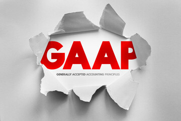 GAAP acronym revealed through torn paper, symbolizing transparency and financial accuracy....