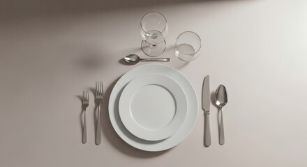 A sophisticated and modern dinner table arrangement with pristine white plates and polished silverware, illustrating culinary etiquette