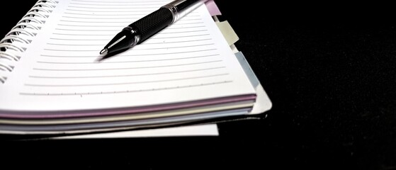 Black pen on lined notebook