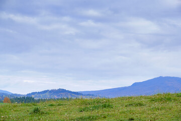 Fototapeta premium Wide landscape with mountain meadow and cloudy sky in Bavaria, Germany