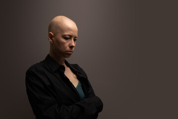 Fototapeta premium Female cancer patient suffering from anxiety and depression, symbol of psychological burden, pain, and emotional exhaustion.