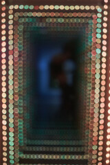 Abstract background of a colorful bokeh light tunnel.