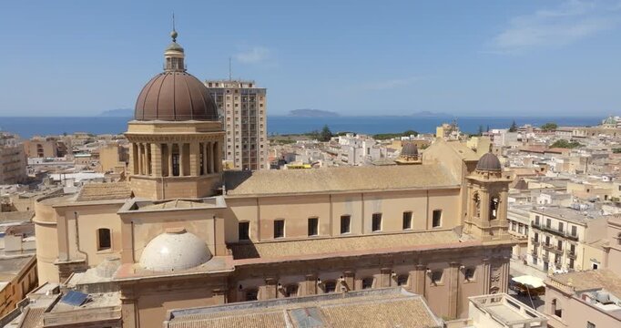Aerial closeup of Marsala Cathedral, located in the province of Trapani, Sicily, Italy. It has a Baroque-style dome. It is dedicated to the Anglo-Norman Saint Thomas Becket.