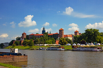 Obraz premium Riverside View of Wawel Castle in Kraków, Poland, Former Royal Residence and National Landmark