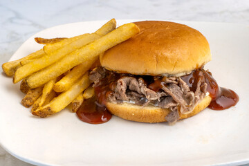 steak sandwich with a side of fries