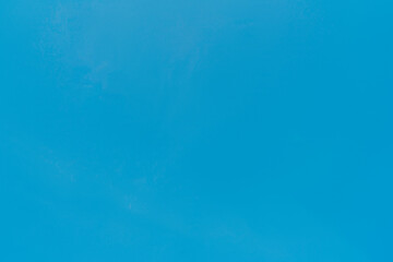Clear blue sky with soft clouds during midday in a tranquil setting, showcasing the beauty of nature and serenity