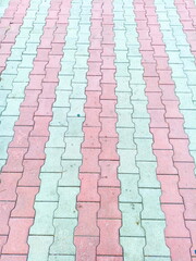 Fototapeta premium Background graphic abstraction: multi-colored street tiles in parks and squares of Odessa.