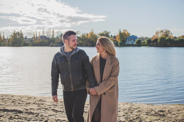 Romantic European couple in the park love, warmth and emotional connection