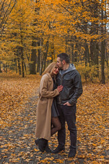 Romantic European couple in the park love, warmth and emotional connection