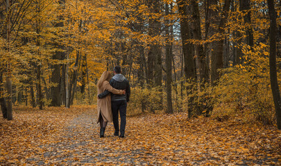 Romantic European couple in the park love, warmth and emotional connection