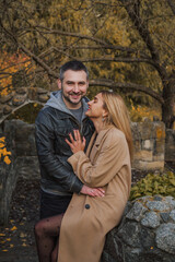 Romantic European couple in the park love, warmth and emotional connection