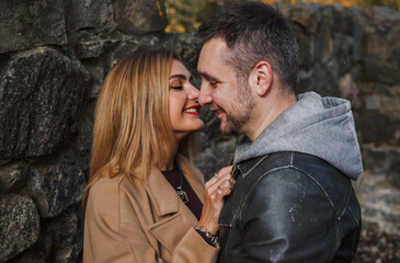 Romantic European couple in the park love, warmth and emotional connection