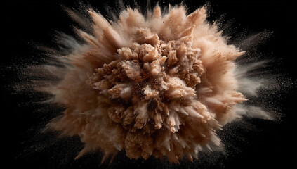 Explosion of brown powder against a black background