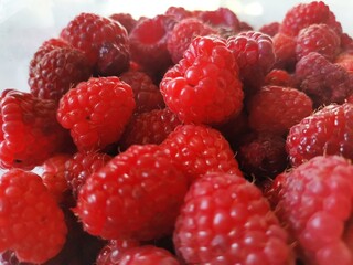 raspberries on a white background