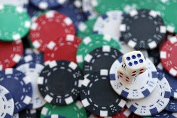 Dice game on the poker table in the casino. A successful combination of dice brought a lot of winning chips