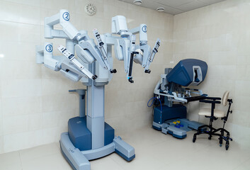 Surgical robotic system in modern operating room. Advanced robotic surgery machine with control console in hospital