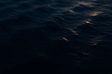 Dark Blue Ocean Waves Under Soft Evening Light