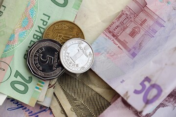 Big amount of different Ukrainian hryvnia money bills. Pile of crumpled ukrainian banknotes