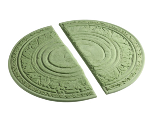 Two ornate, pale green stone halves of a circular object