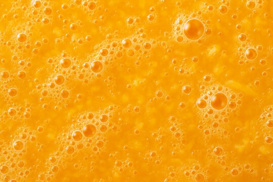 Close up of orange juice with bubbles for a refreshing and healthy drink