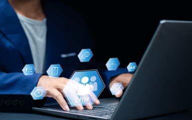 Businessman. glass focusing on CRM, representing customer relationship management, business strategy, data analysis, marketing automation and client retention concept.