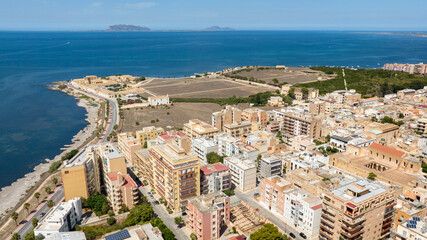 Aerial view of the archaeological site of Lilibeo (Lilybaeum for the Romans), located near Marsala, Sicily, Italy. In foreground are the buildings of the town and in background are the Egadi Islands.