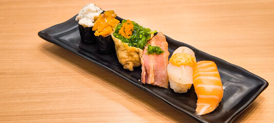 Sushi on a black plate Japanese food