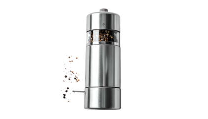 Sleek stainless steel pepper grinder spilling peppercorns