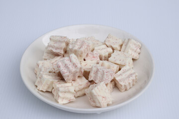 Fresh sliced taro root on white background