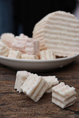 Fresh sliced taro root on white plate close up