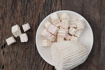 Fresh sliced taro root on white plate close up