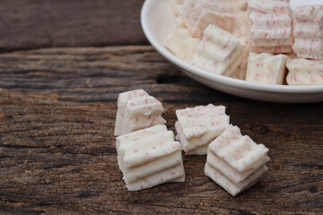 Fresh sliced taro root on white plate close up