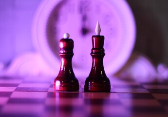 chess pieces king and queen on the chess board 