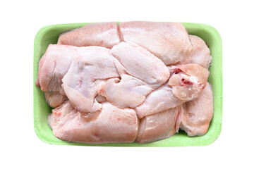 Raw whole chicken cut on a foam meat tray on white background.