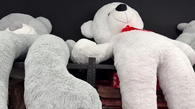 many large plush teddy bears on display
