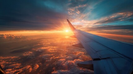 airplane wing flying through vibrant sunset