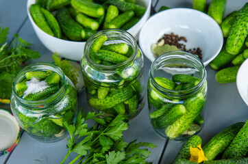 Preserving cucumbers in jars. Selective focus.