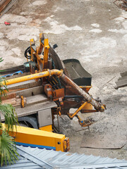 Concrete Pouring from Mixer Truck into Pump Hopper 