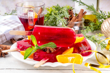 Tasty winter mulled wine ice cream popsicles. Frozen mulled wine cocktail on sticks, traditional...