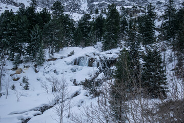 a frozen mountain waterfall in the Polish Tatra Mountains