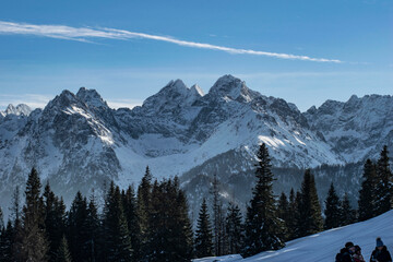 a panorama of the snow-covered Polish Tatra Mountains in winter weather