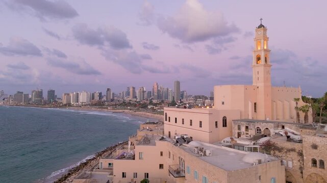 Aerial view of St. Peter Church with the skyline in the background, a captivating blend of history and modernity, Old Jaffa, Tel Aviv-Yafo, Israel.
