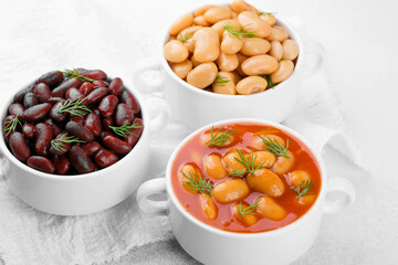Kidney, butter and baked beans in bowls on towel for protein food, clean eating or vegan variety concept