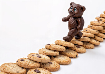 chocolate bear on a mountain of cookies, sweets, desserts