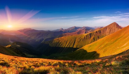 Fototapeta premium stunning panoramic view of the mountain range with its colorful slopes and valley during golden hour creating a picturesque landscape