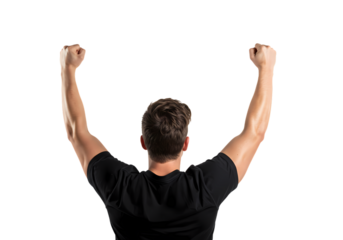 Man celebrating success with arms raised high against dark