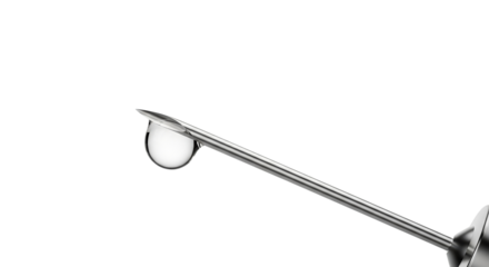 Tip of a syringe with a drop in close-up on a transparent background  