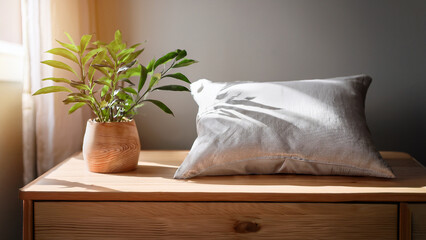 Linen Pillow Beside Wooden Bedside Table