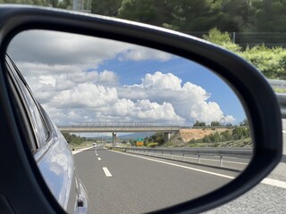 View of a modern highway in the rearview mirror of a passenger car (Zadar, Croatia) - Pogled na modernu autocestu u retrovizoru osobnog automobila (Zadar, Hrvatska)