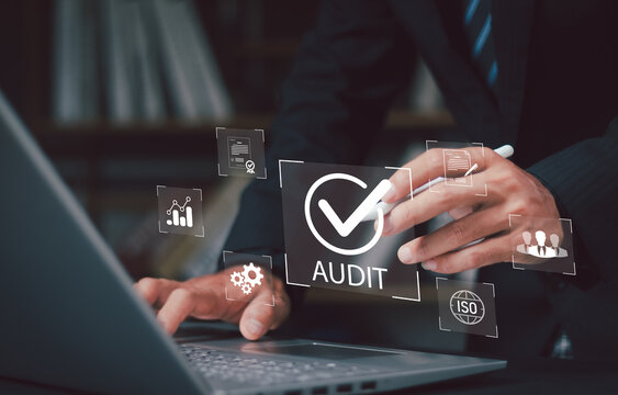Corporate audit and financial review concept showing businessman analyzing data and reports on laptop symbolizing auditing practices business performance evaluation compliant and strategic assessments